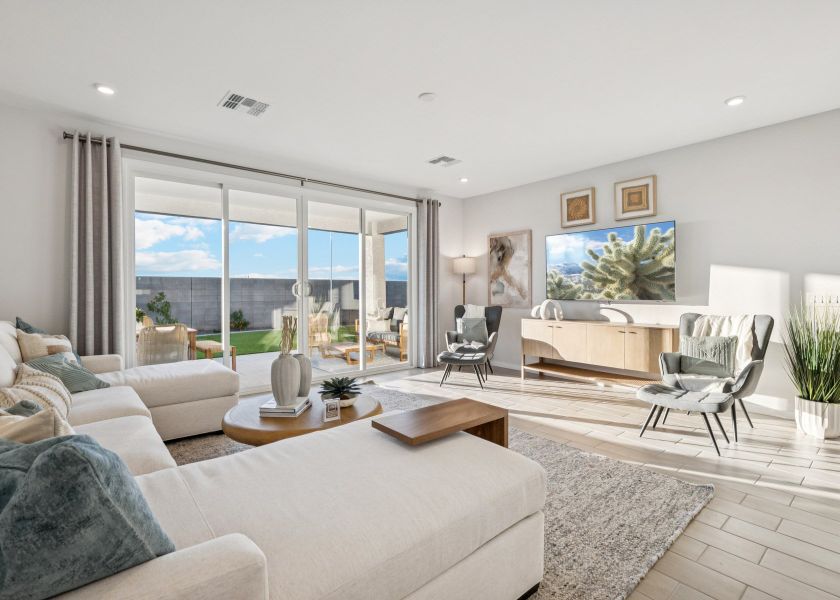 A living room with a large window. A living room with a large window.