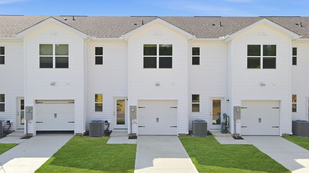 Front exterior of a new home in Clock Road Townhomes, New Bern, NC, highlighting curb appeal (Image 24).