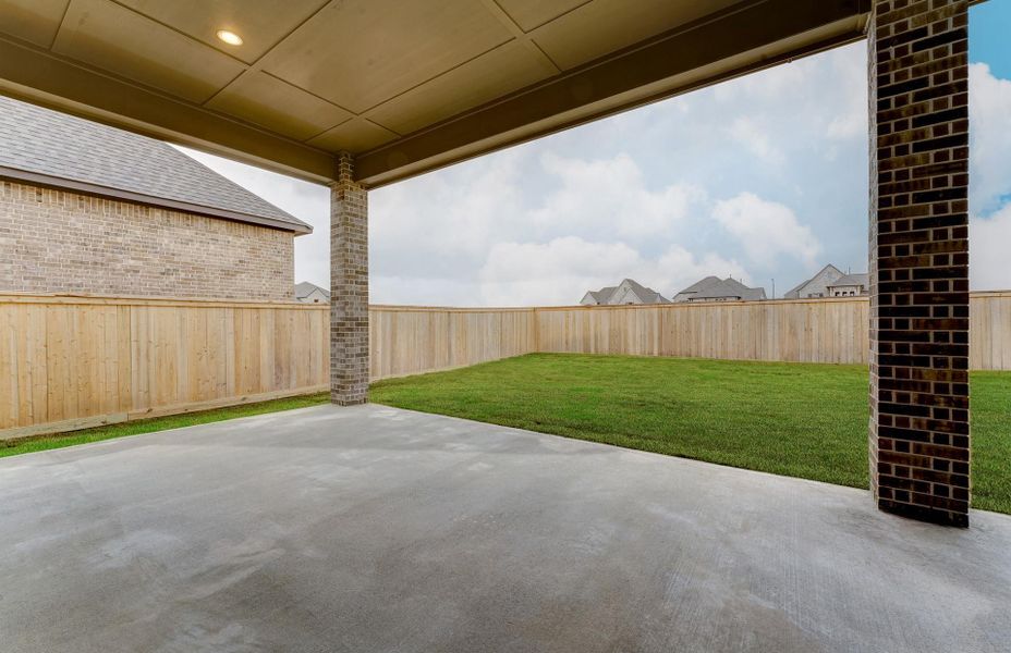 Exterior details and patio area of a home in The Woodlands Hills 65′, Willis (Image 27).