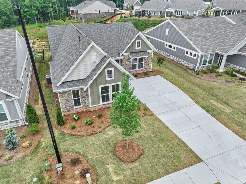 Front exterior of a new home in Laurel Farms, Dallas, GA, highlighting curb appeal (Image 22). Front exterior of a new home in Laurel Farms, Dallas, GA, highlighting curb appeal (Image 22).