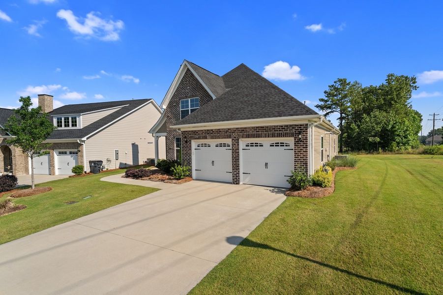 Front exterior of a new home in Taylor Oaks, Greenville, SC, highlighting curb appeal (Image 21). Front exterior of a new home in Taylor Oaks, Greenville, SC, highlighting curb appeal (Image 21).
