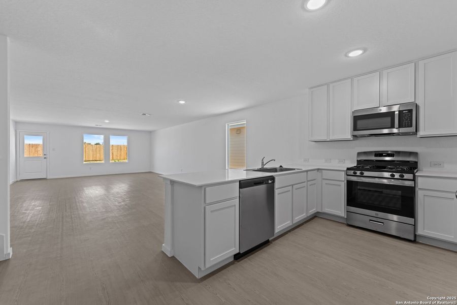 Furnished interior view inside a new home in Lodi Grove, Floresville (Image 6).