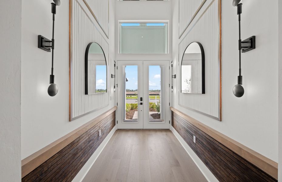 Representative unfurnished interior of a home built from the Layton Grande by DiVosta in BeachWalk by Manasota Key, Englewood (Image 21).