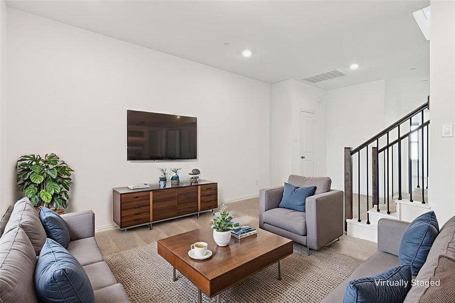 2nd level Living area with carpet flooring, recessed lighting, and wrought iron stairs 2nd level Living area with carpet flooring, recessed lighting, and wrought iron stairs