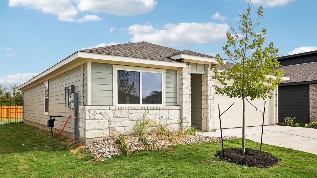 Front exterior of a new home in Trails at Wildhorse, Austin, TX, highlighting curb appeal (Image 17). Front exterior of a new home in Trails at Wildhorse, Austin, TX, highlighting curb appeal (Image 17).