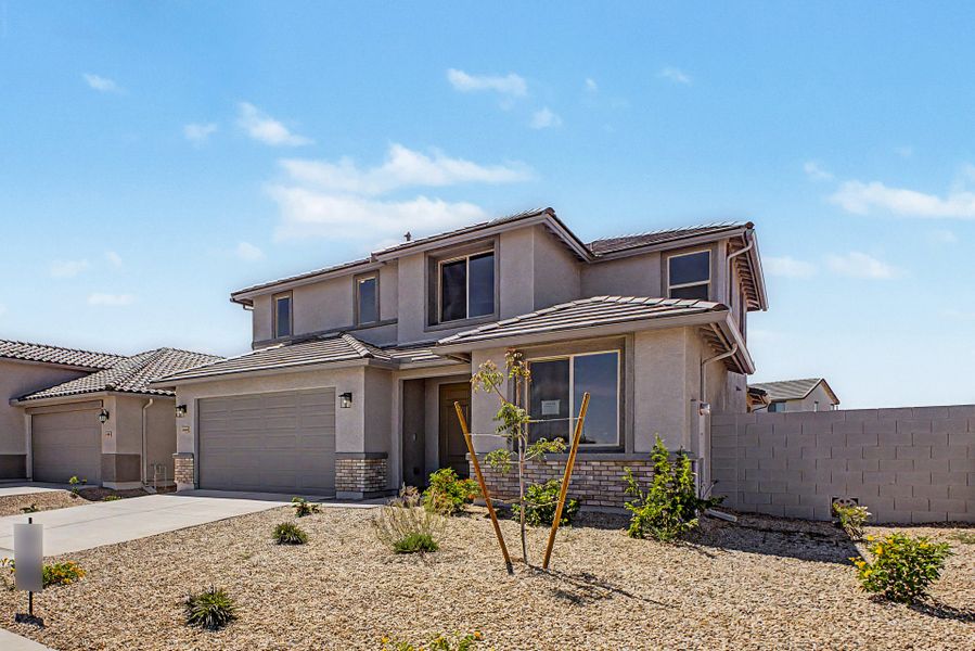 Front exterior of a new home in Wildera, San Tan Valley, AZ, highlighting curb appeal (Image 2). Front exterior of a new home in Wildera, San Tan Valley, AZ, highlighting curb appeal (Image 2).