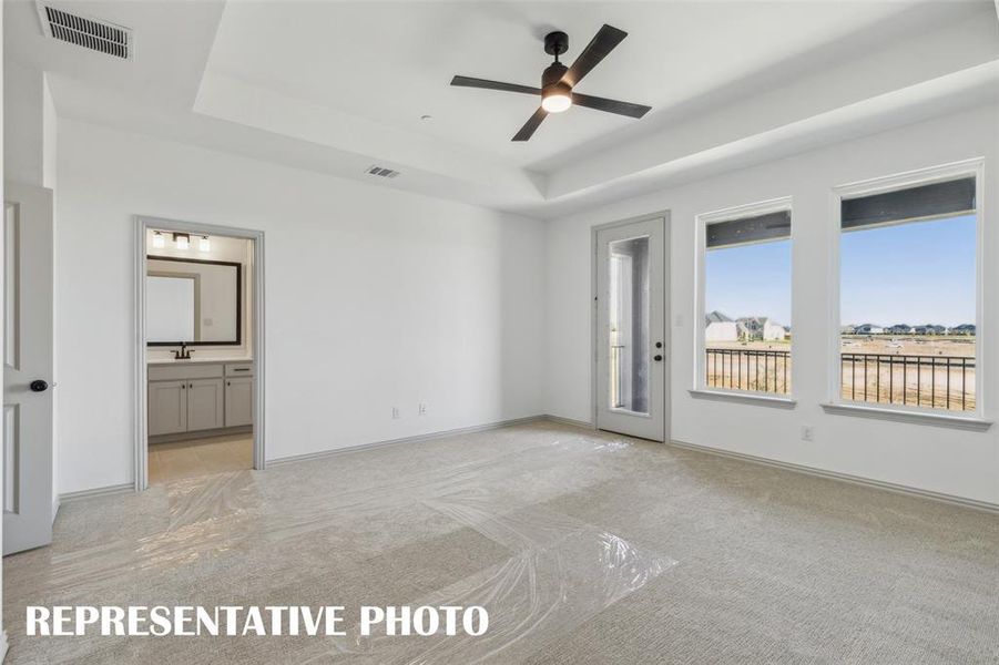 A light filled owner's suite that offers high ceilings, tons of natural light and a wonderful owner's bath....our Sunny Interior floor plan has it all!  REPRESENTATIVE PHOTO