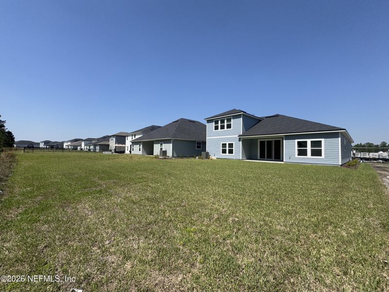 Exterior details and patio area of a home in Hyland Trail, Green Cove Springs (Image 24).