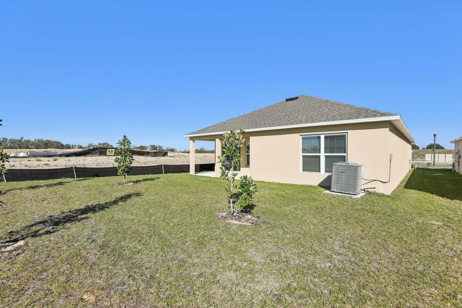 Exterior details and patio area of a home in Robins Run, Lake Wales (Image 19).