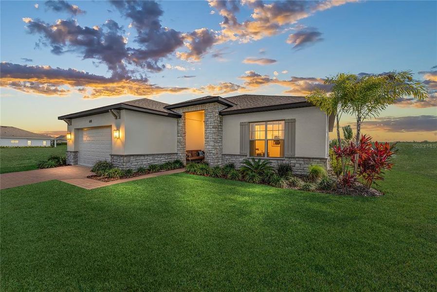 Front exterior of a new home in , Auburndale, FL, highlighting curb appeal (Image 2).