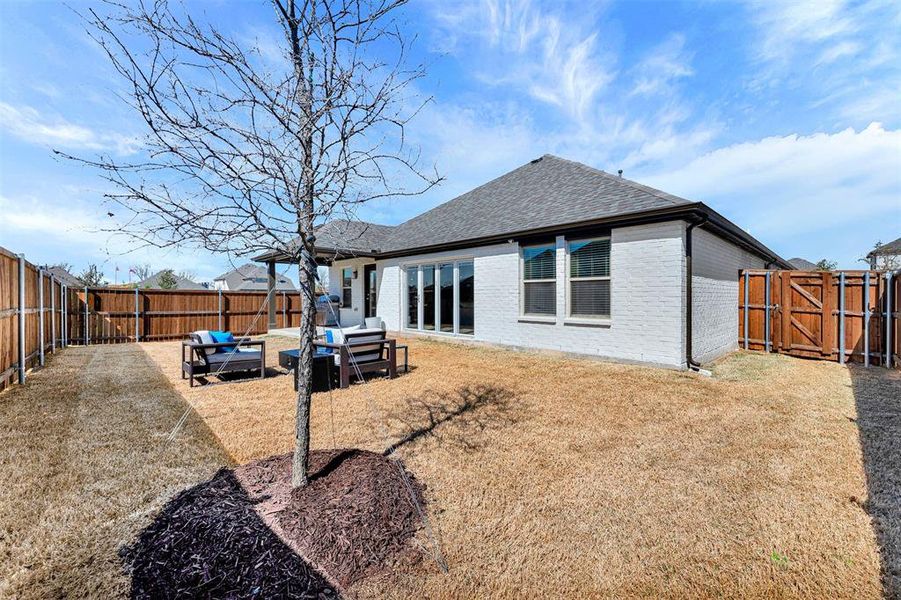 Exterior details and patio area of a home in Woodstone, Providence Village (Image 26). Exterior details and patio area of a home in Woodstone, Providence Village (Image 26).