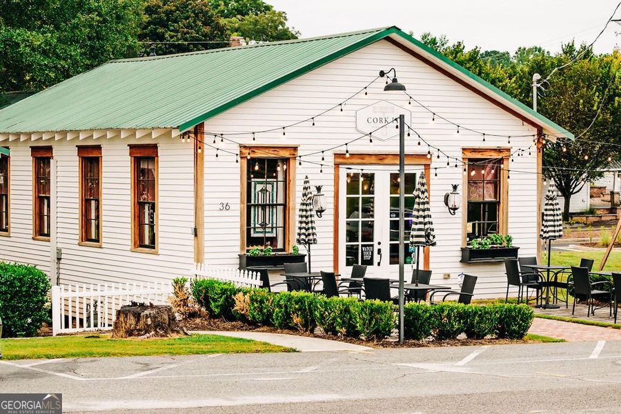 Front exterior of a new home in Rosewood Lake Estates, Hoschton, GA, highlighting curb appeal (Image 37).