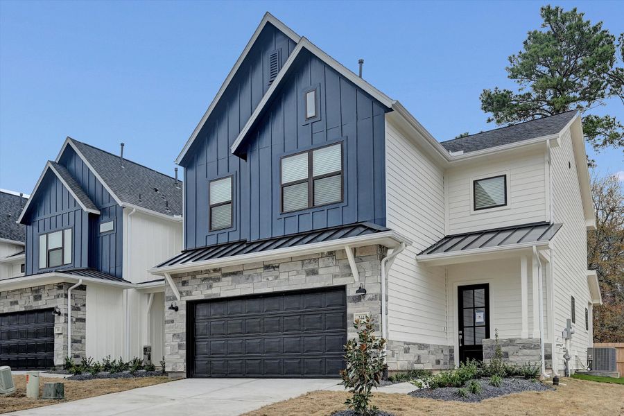 Front exterior of a new home in Summer Place 35', Montgomery, TX, highlighting curb appeal (Image 28). Front exterior of a new home in Summer Place 35', Montgomery, TX, highlighting curb appeal (Image 28).