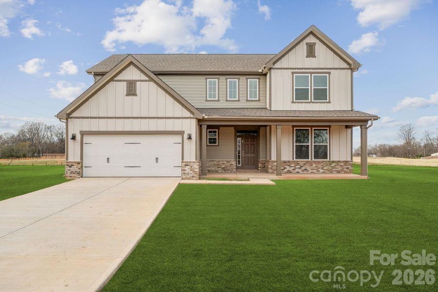 Front exterior of a new home in Stonemill, Monroe, NC, highlighting curb appeal (Image 1). Front exterior of a new home in Stonemill, Monroe, NC, highlighting curb appeal (Image 1).