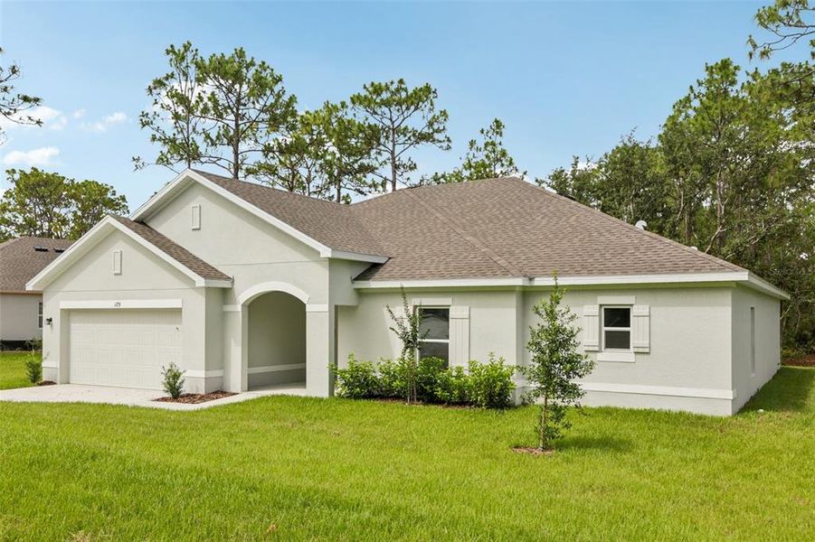 Front exterior of a new home in Sugarmill Woods, Homosassa, FL, highlighting curb appeal (Image 1).