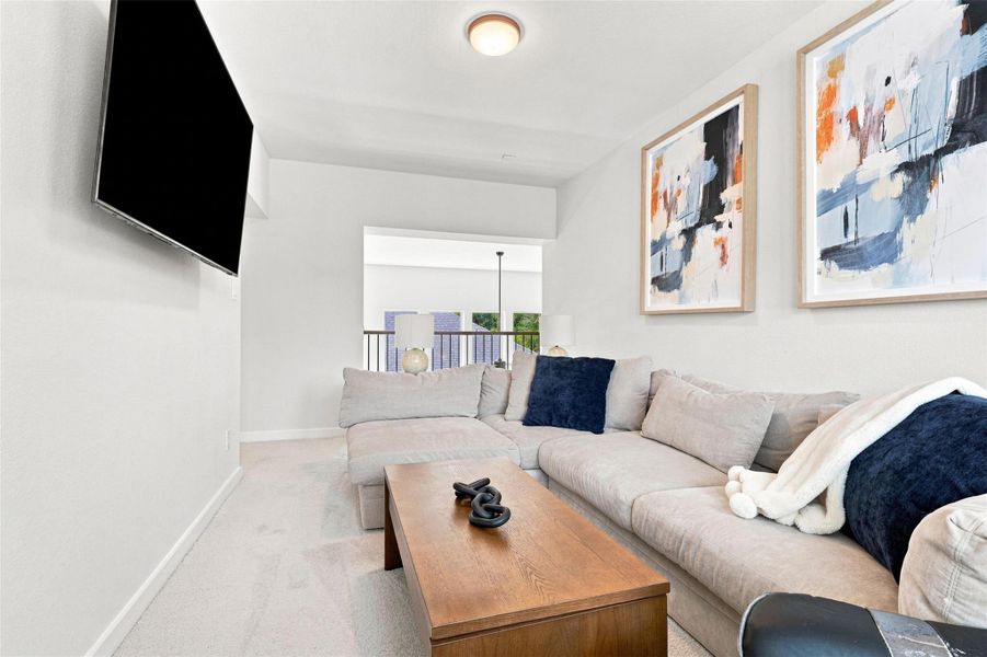 Game room on second floor overlooking living space below.