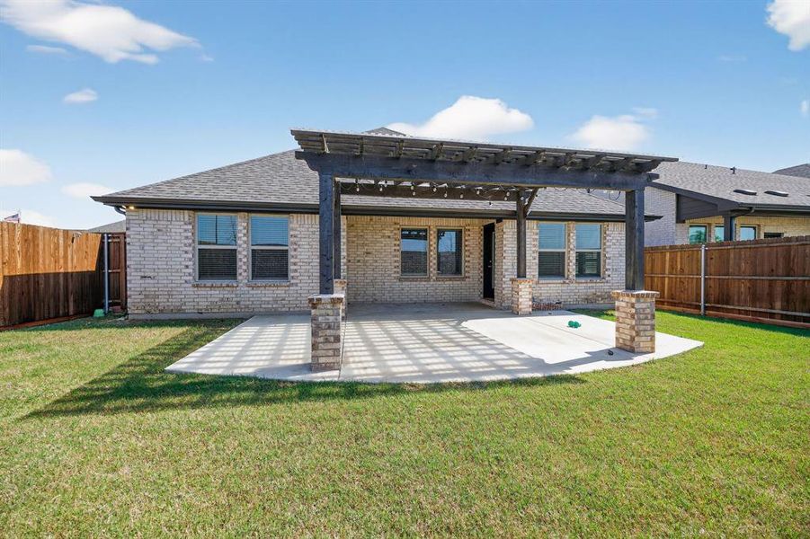 Exterior details and patio area of a home in Valencia on the Lake, Little Elm (Image 2). Exterior details and patio area of a home in Valencia on the Lake, Little Elm (Image 2).