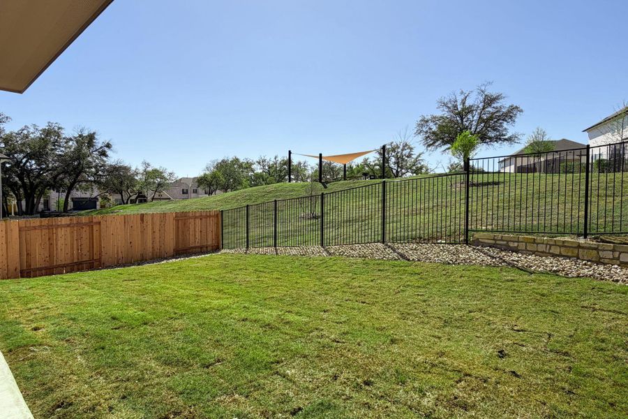 View of fenced backyard