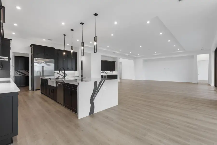 Furnished interior view inside a new home in Astor Creek Golf & Country Club, Port St. Lucie (Image 9).