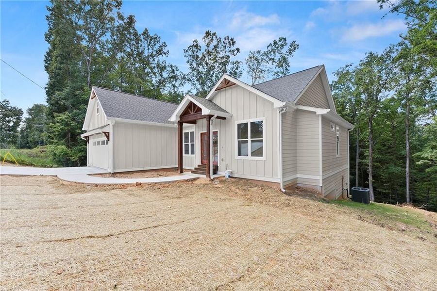 Front exterior of a new home in , Gainesville, GA, highlighting curb appeal (Image 1).