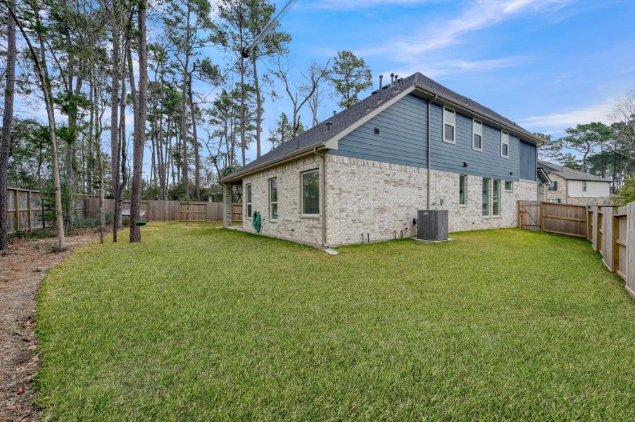 Situated on a large upgraded lot with no rear neighbors, offering peaceful green space views and added privacy.