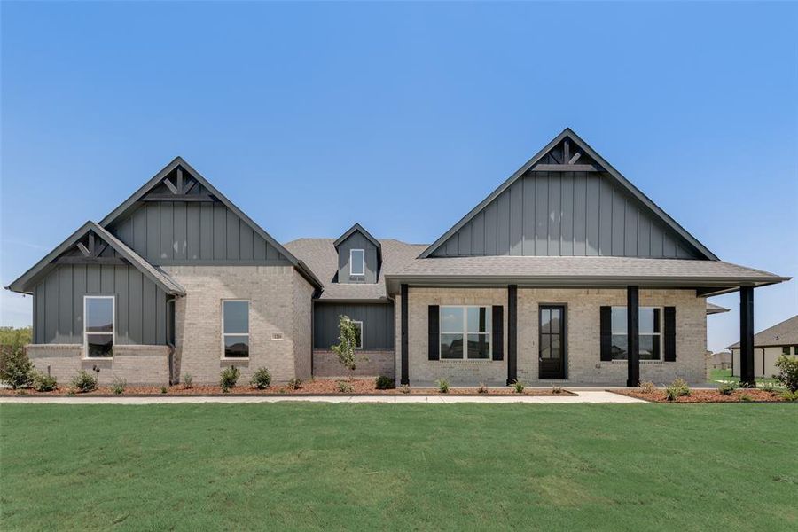 View of front of house featuring a front lawn