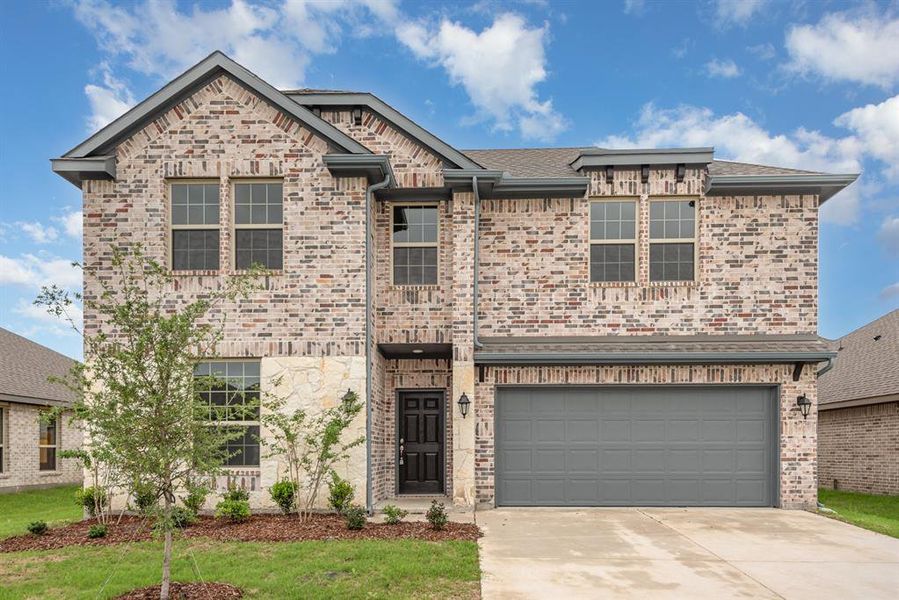 View of front of home with a garage