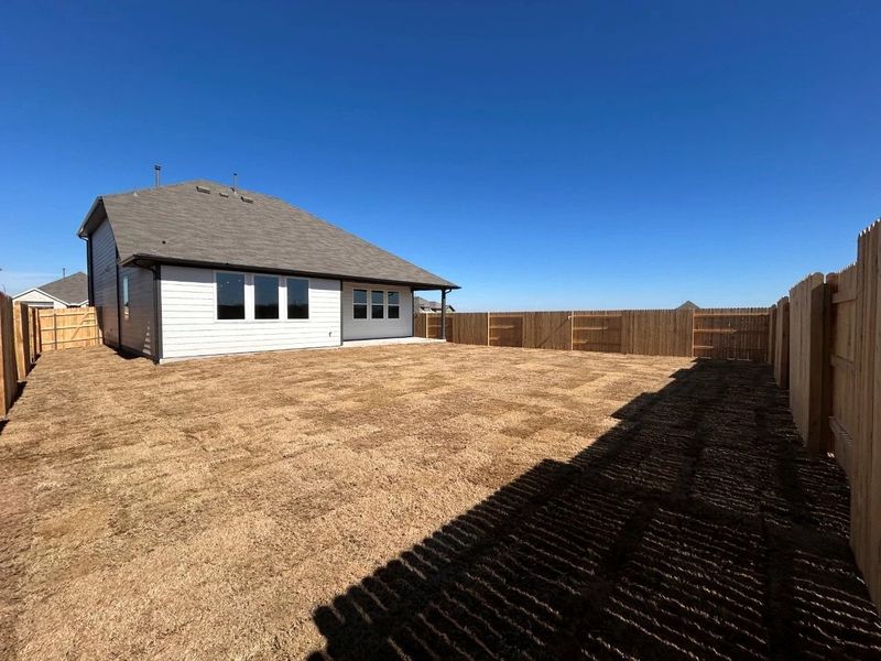 Exterior details and patio area of a home in Willow Springs, Buda (Image 17).