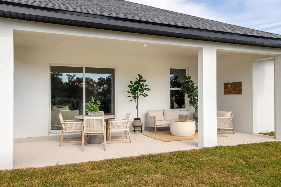 A relaxing covered lanai designed for year-round outdoor enjoyment, with space for dining, lounging, and taking in the natural surroundings. A relaxing covered lanai designed for year-round outdoor enjoyment, with space for dining, lounging, and taking in the natural surroundings.