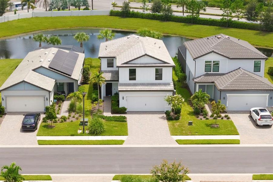 Front exterior of a new home in , Bradenton, FL, highlighting curb appeal (Image 25).