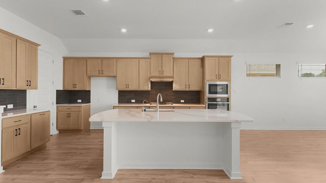 Representative furnished interior of a home built from the Bryson by Chesmar Homes in Newhaven, Manor (Image 5).