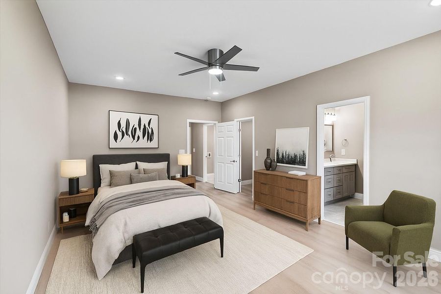 PRIMARY BEDROOM -downstairs - main -Virtually Staged living area