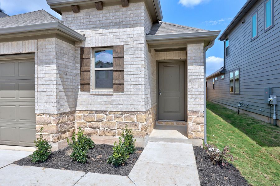 Exterior details and patio area of a home in Trinity Ranch, Elgin (Image 3).