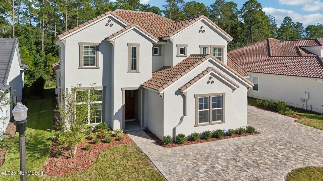 Front exterior of a new home in Tamaya, Jacksonville, FL, highlighting curb appeal (Image 28). Front exterior of a new home in Tamaya, Jacksonville, FL, highlighting curb appeal (Image 28).