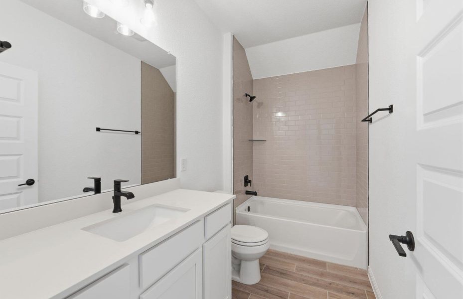 Furnished interior view inside a new home in West Cypress Hills, Spicewood (Image 7).