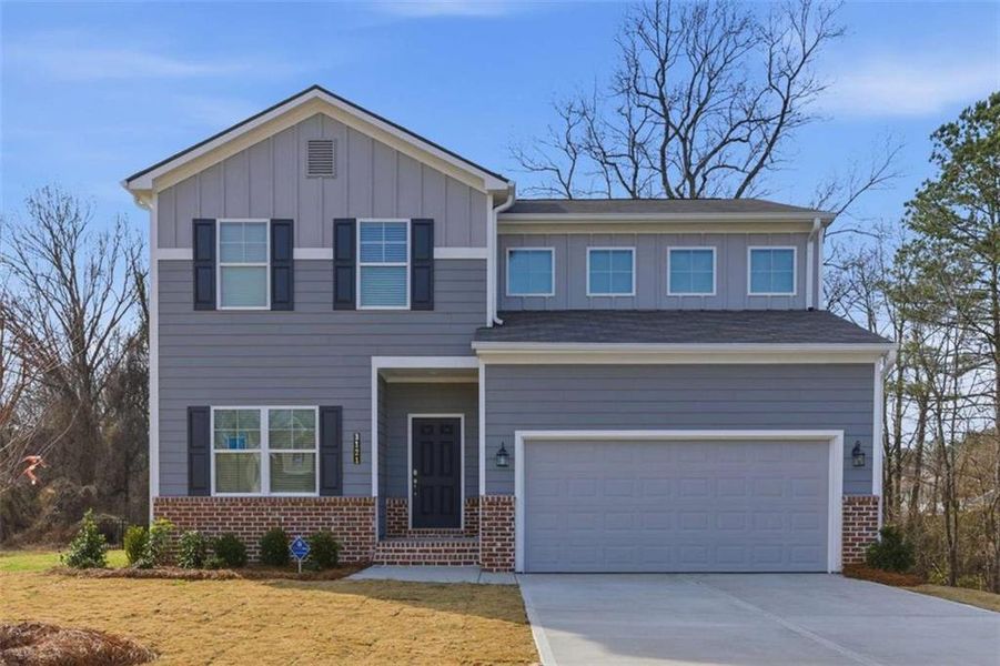 Front exterior of a new home in The Reserve at Chapel Hill Phase II, Douglasville, GA, highlighting curb appeal (Image 1). Front exterior of a new home in The Reserve at Chapel Hill Phase II, Douglasville, GA, highlighting curb appeal (Image 1).