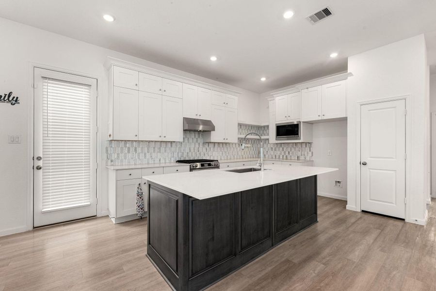 Furnished interior view inside a new home in Sunterra, Katy (Image 13).