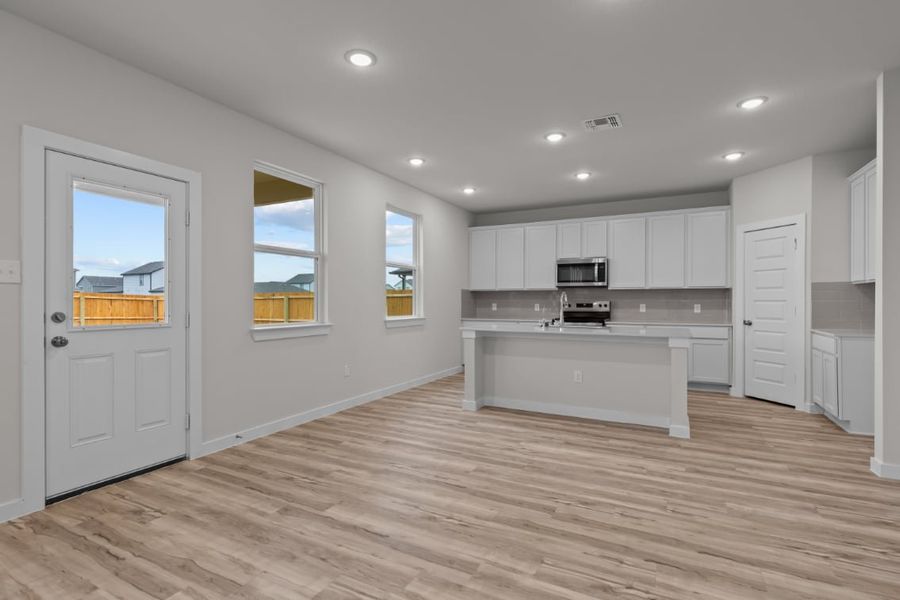 A kitchen with white cabinets. A kitchen with white cabinets.