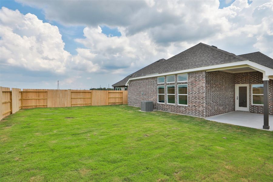 Exterior details and patio area of a home in Creekhaven, Iowa Colony (Image 2). Exterior details and patio area of a home in Creekhaven, Iowa Colony (Image 2).