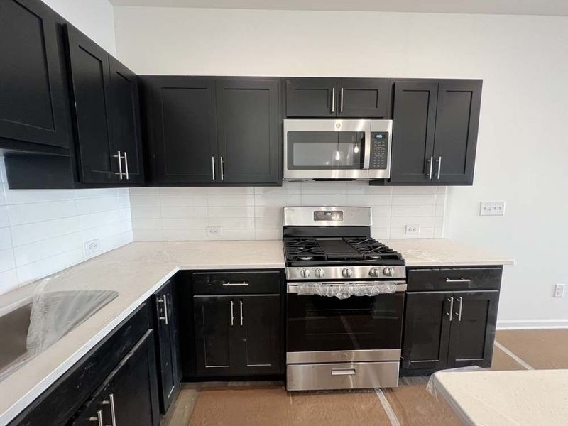 Kitchen featuring Industrial Collection Finishes Construction Progress