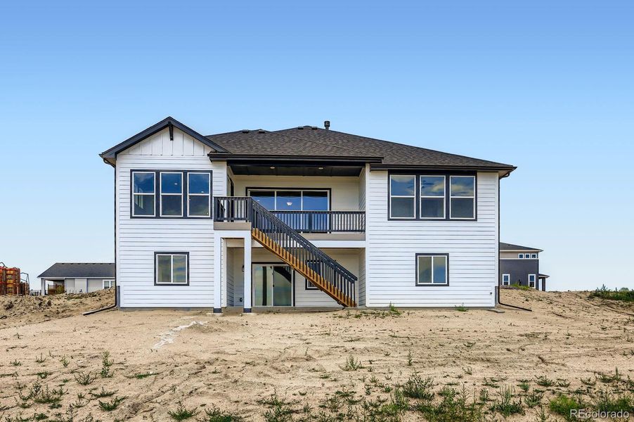 Front exterior of a new home in Timber Ridge, Colorado Springs, CO, highlighting curb appeal (Image 18).