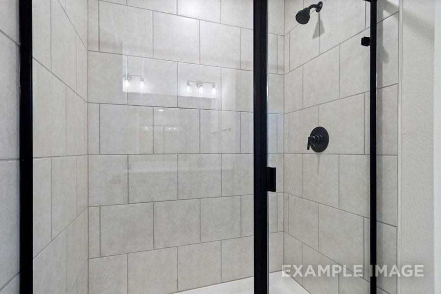 Bathroom with a shower with shower door