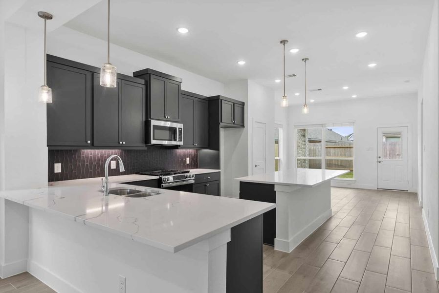 Representative furnished interior of a home built from the Carlisle by Chesmar Homes in Sunterra, Katy (Image 3).