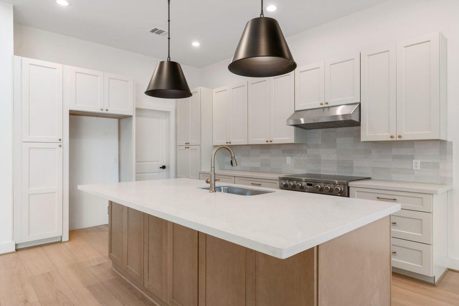 Designer touches and upscale fixtures add a sophisticated flair throughout, with cabinetry that even includes a dedicated microwave niche for a seamless, streamlined look. Designer touches and upscale fixtures add a sophisticated flair throughout, with cabinetry that even includes a dedicated microwave niche for a seamless, streamlined look.