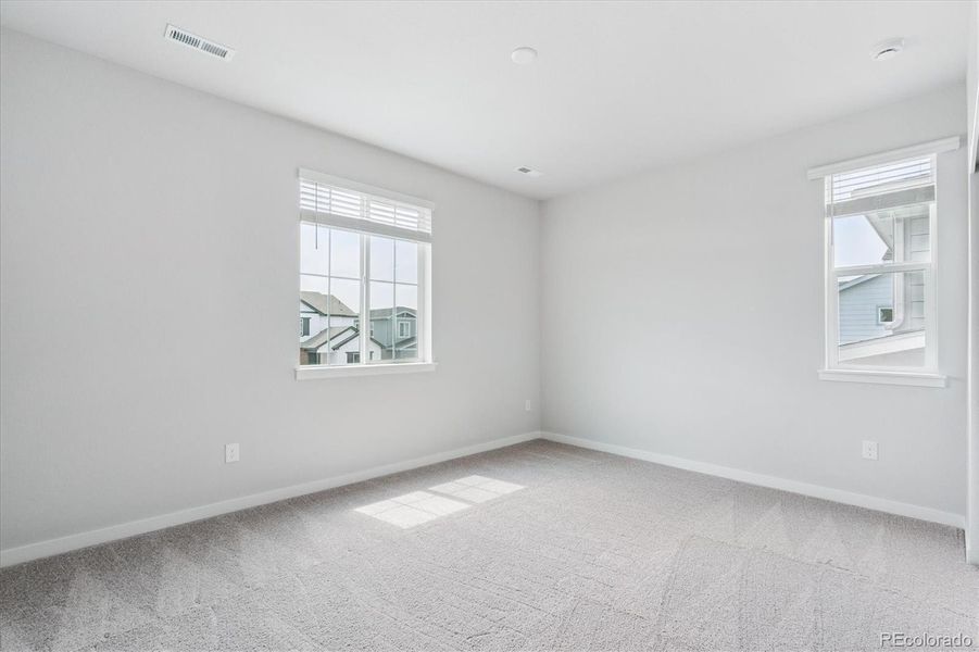 Spacious, unfurnished interior of a new home in Floret Collection at Alder Creek, Parker (Image 19).