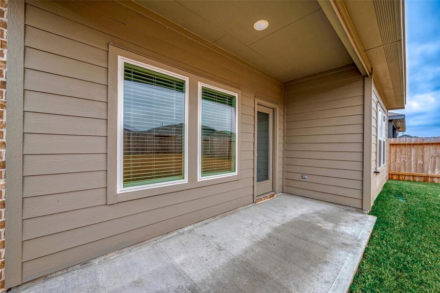 Exterior details and patio area of a home in Breckenridge Forest, Spring (Image 30).