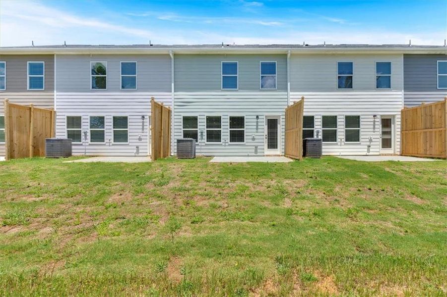 Exterior details and patio area of a home in Village Green, Adairsville (Image 14).