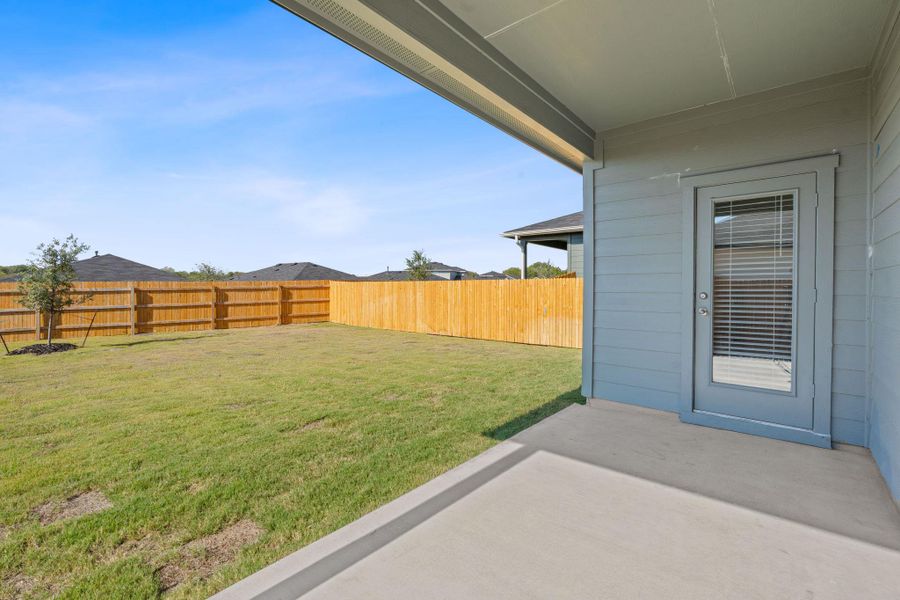 Fenced backyard featuring a patio Fenced backyard featuring a patio