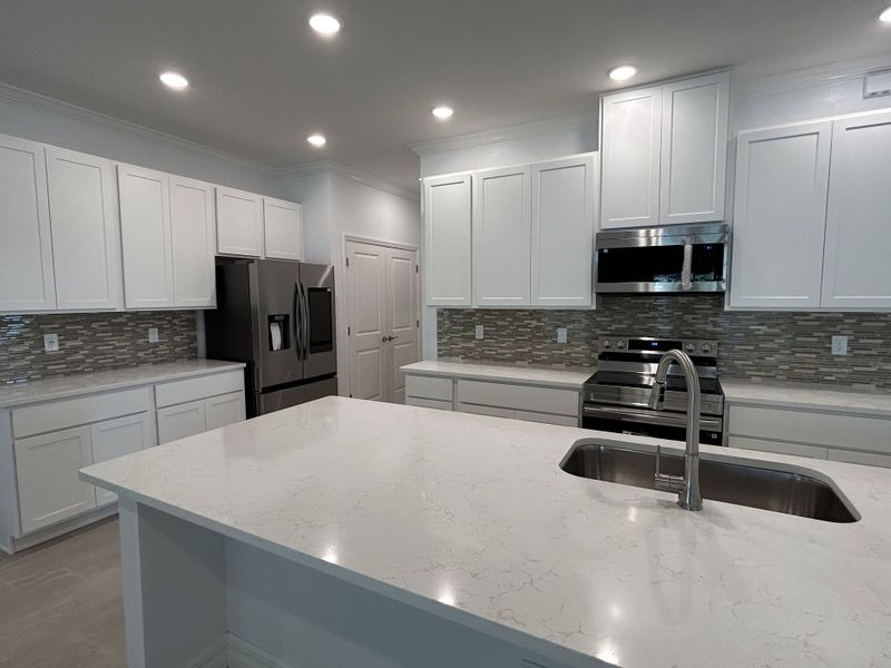 Furnished interior view inside a new home in Burnt Store, Cape Coral (Image 5). Furnished interior view inside a new home in Burnt Store, Cape Coral (Image 5).