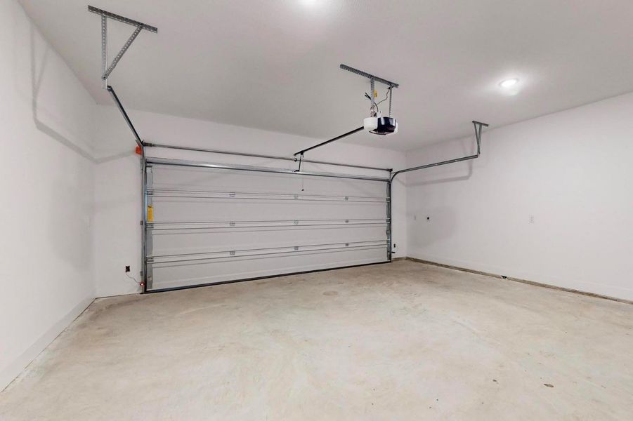 Garage featuring a garage door opener
